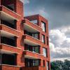 Een voorgeval van een gebouw met rode gevels in De Boterton in Lier | DCA Bouw