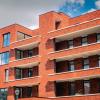 Een bijna afgewerkt gebouw met rode gevelsteen van De Boterton in Lier | DCA Bouw